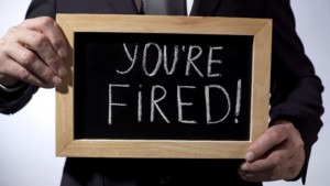 Blackboard with "You're fired!" written on it.