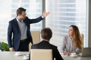 Bullying boss yelling at female employee. 
